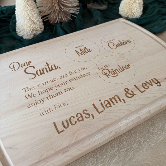 Engraved maple Santa cookie board with milk, cookies, and reindeer treat circles