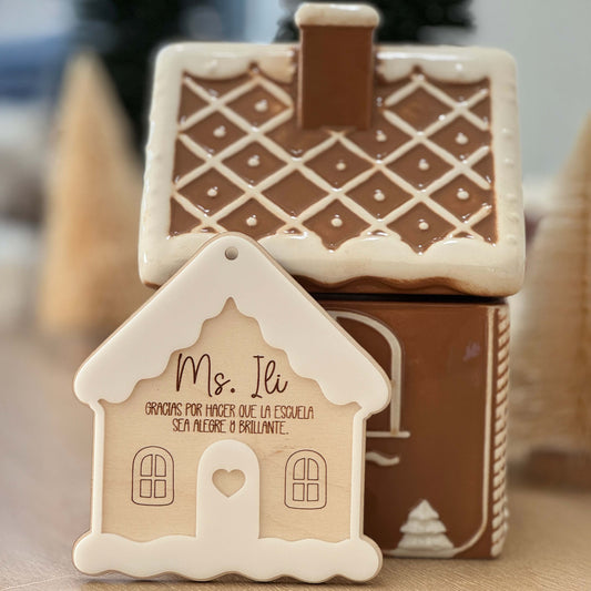 Spanish personalized gingerbread house teacher ornament displayed in holiday scene